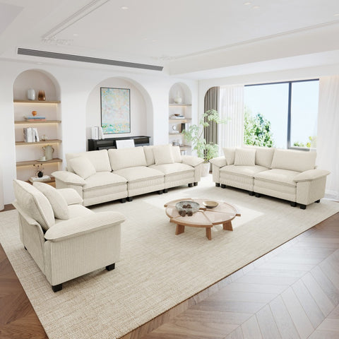 Modern living room with white  beige corduroy sectional cloud sofa, a coffee table, and decorative elements.
